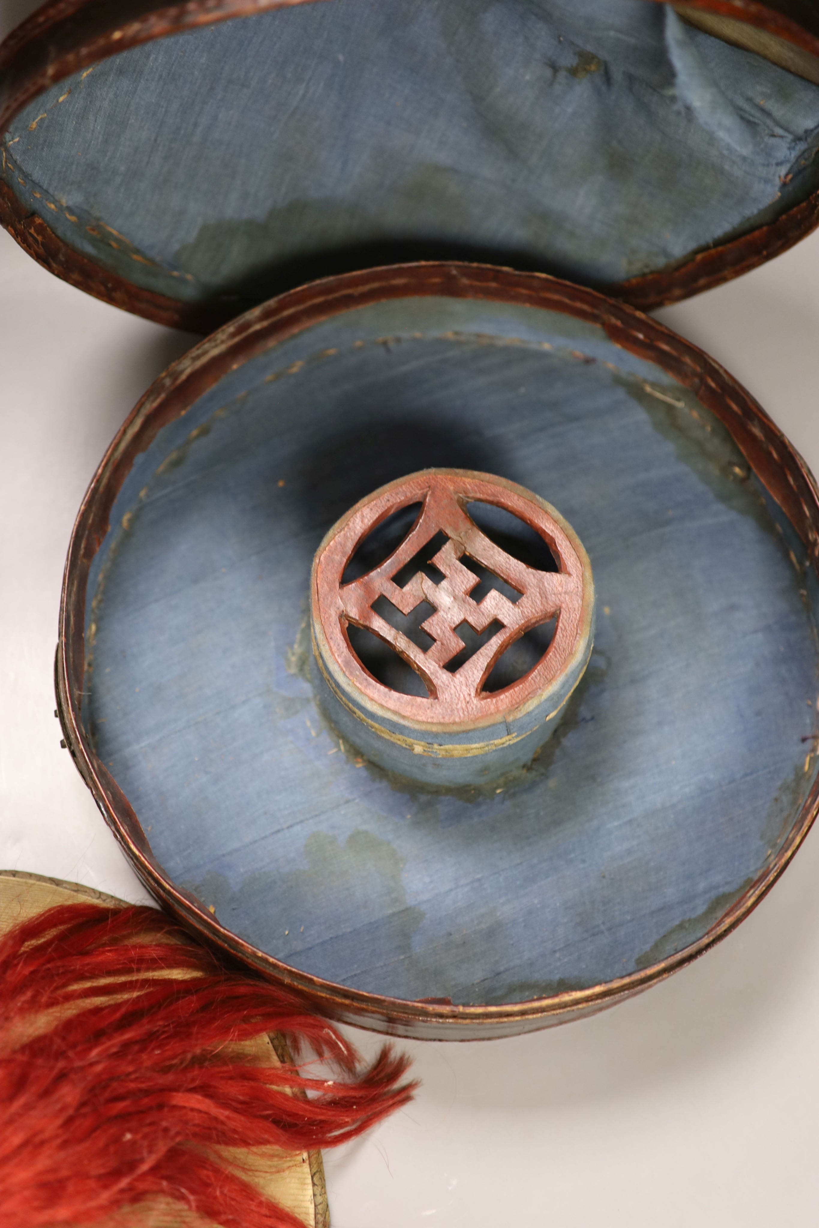 A Chinese late Qing mandarin hat, with gilt finial and original hide case